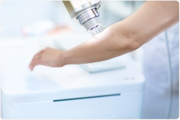 Professional skin examination in dermatology clinic. Image Copyright: SewerynCieslik / Shutterstock